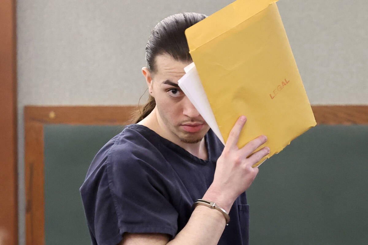 Richard Babb, who was convicted of sex trafficking multiple children, hides his face from news ...