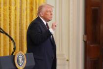 President Donald Trump gestures as he departs a reception celebrating Greek Independence Day in ...