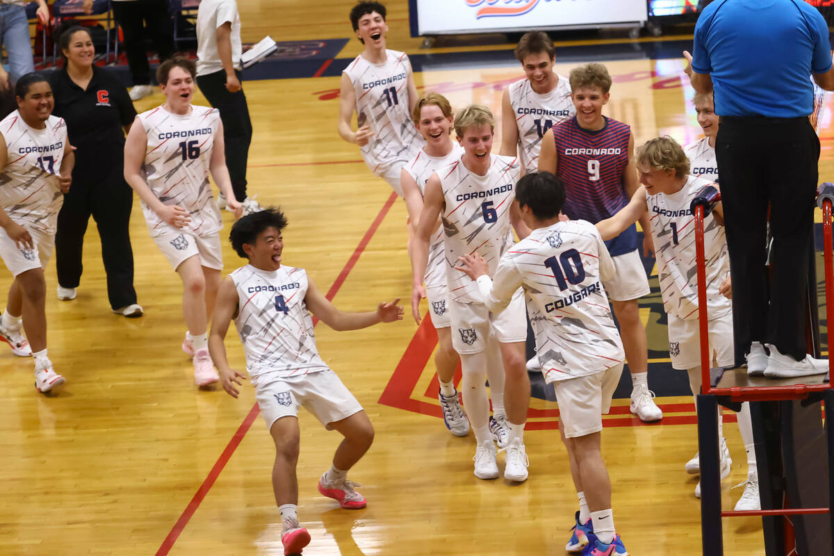 Coronado players celebrate their victory over Palo Verde in a high school volleyball game at Co ...