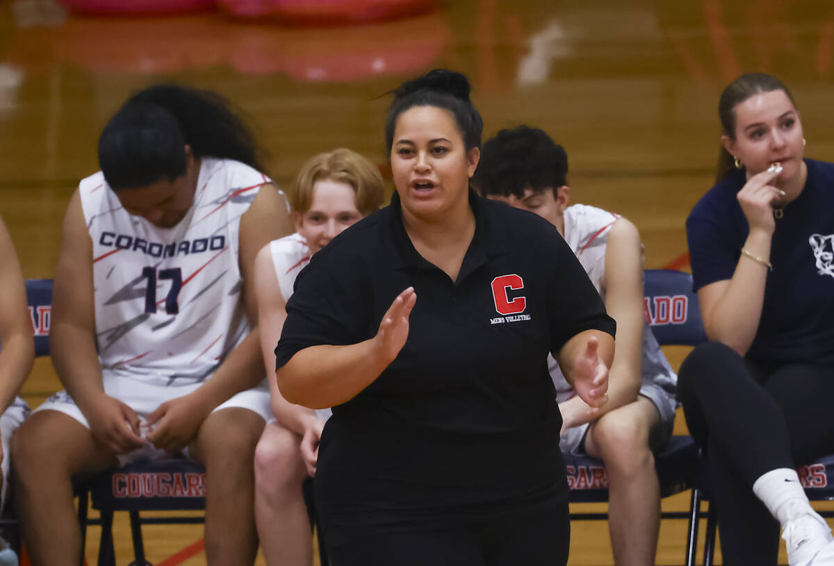 Coronado head coach Jazlynn Mau talks to her team during a high school volleyball game against ...