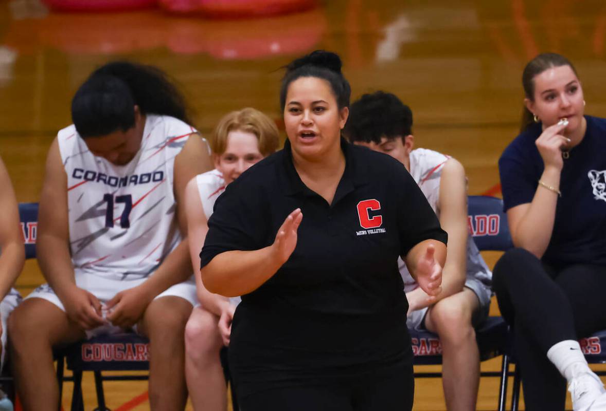 Coronado head coach Jazlynn Mau talks to her team during a high school volleyball game against ...