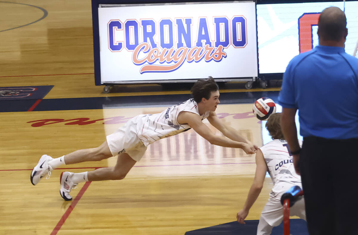 Coronado's Cameron Smith dives for the ball during a high school volleyball game against Palo V ...