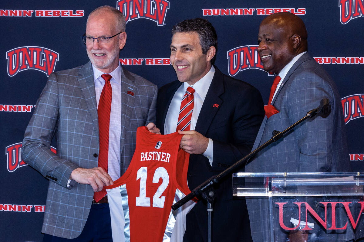 UNLV Officer in Charge Chris Heavey, new men's basketball coach Josh Pastner and Director of At ...
