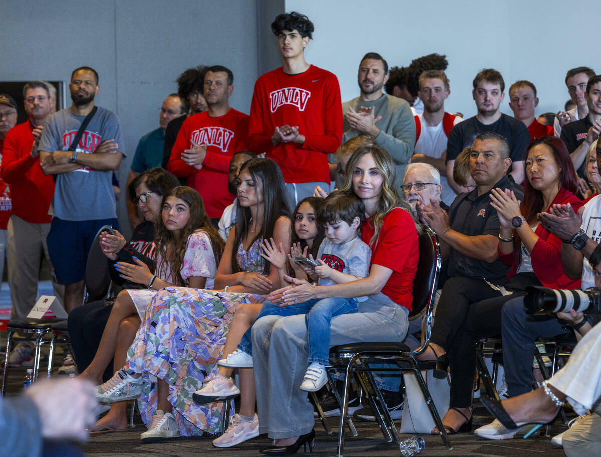 The family of new UNLV men's basketball coach Josh Pastner, players and others applaud him as h ...