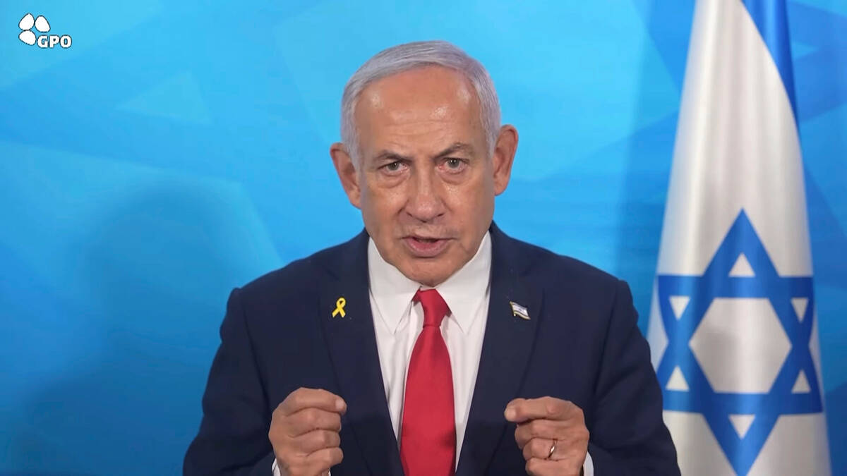In this image made from a video released by the Israeli Government Press Office, Prime Minister ...
