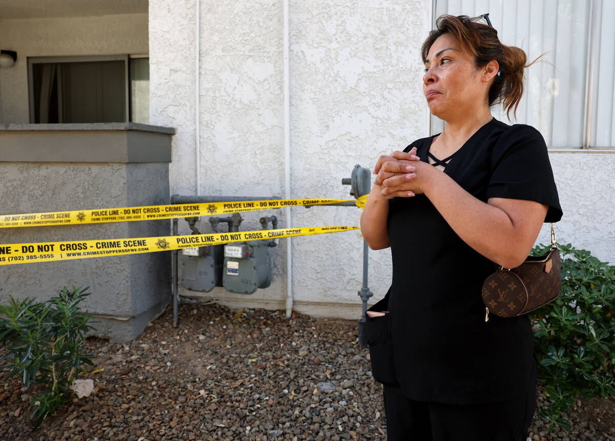 Neighbor Jessica Flores talks to the Review-Journal as Metropolitan Police Department officers ...