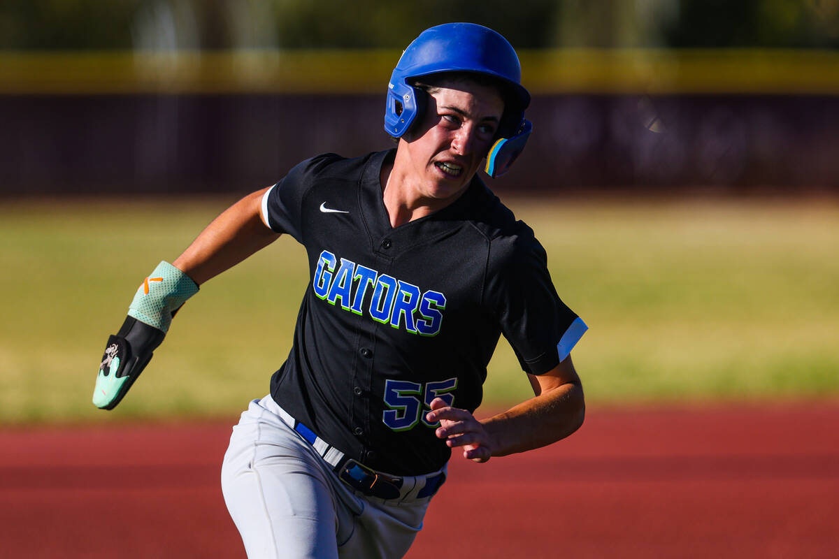 Green Valley outfielder Jet McNelis runs to home base during a high school baseball game betwee ...