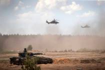 FILE - Eurocopters Tiger of the German Army take part in the Lithuanian-German division-level i ...