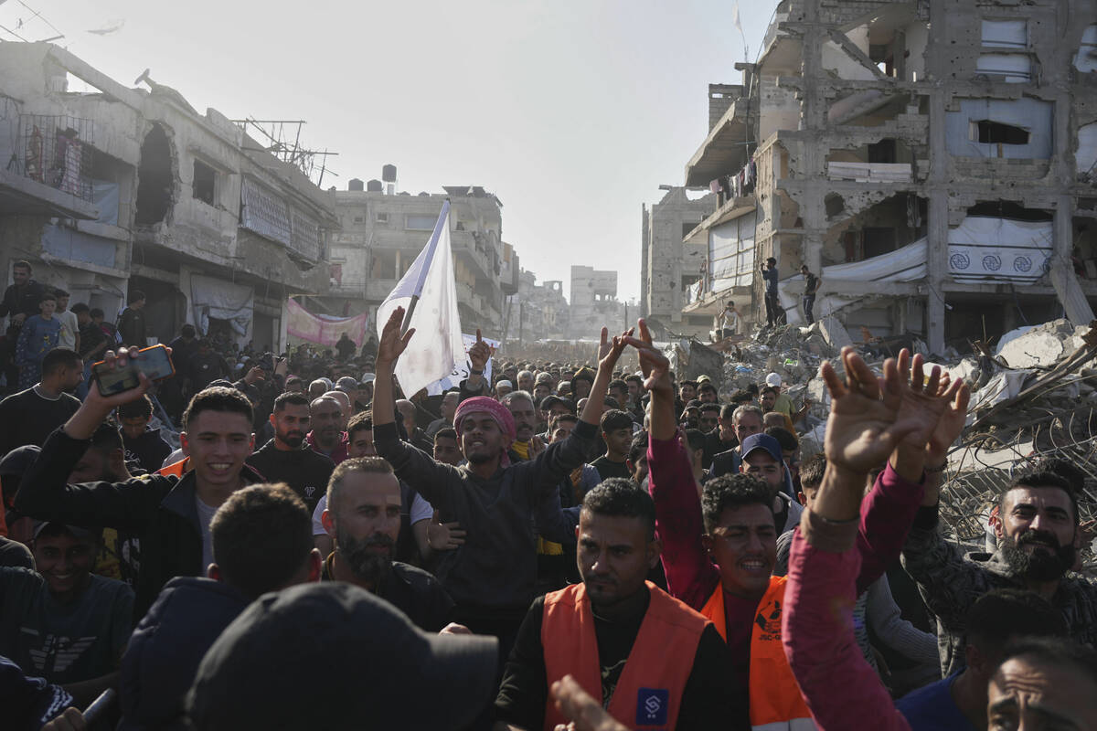Palestinians chant slogans during an anti-war protest and against Hamas in a rare show of publi ...