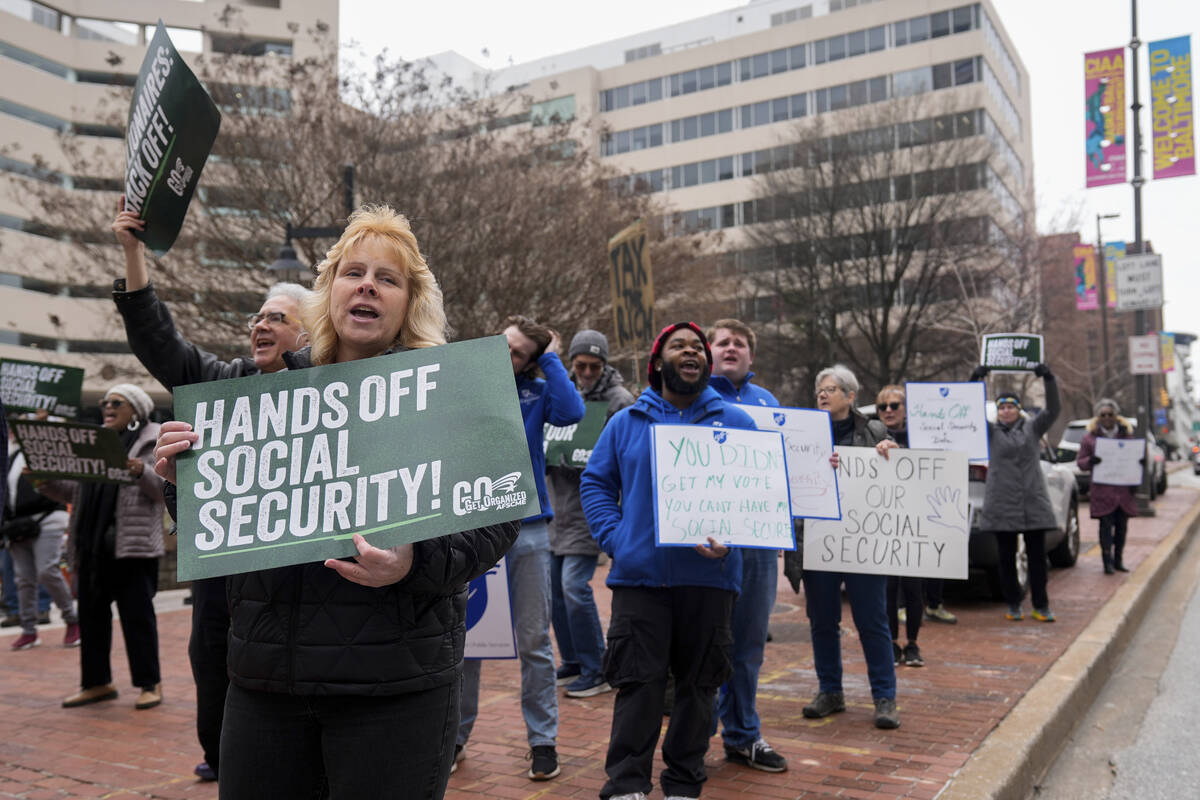 Demonstrators gather outside of the Edward A. Garmatz United States District Courthouse in Balt ...