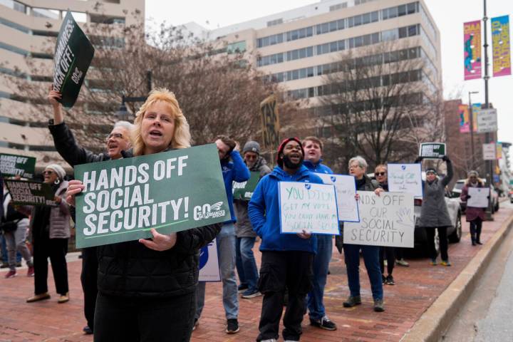 Demonstrators gather outside of the Edward A. Garmatz United States District Courthouse in Balt ...