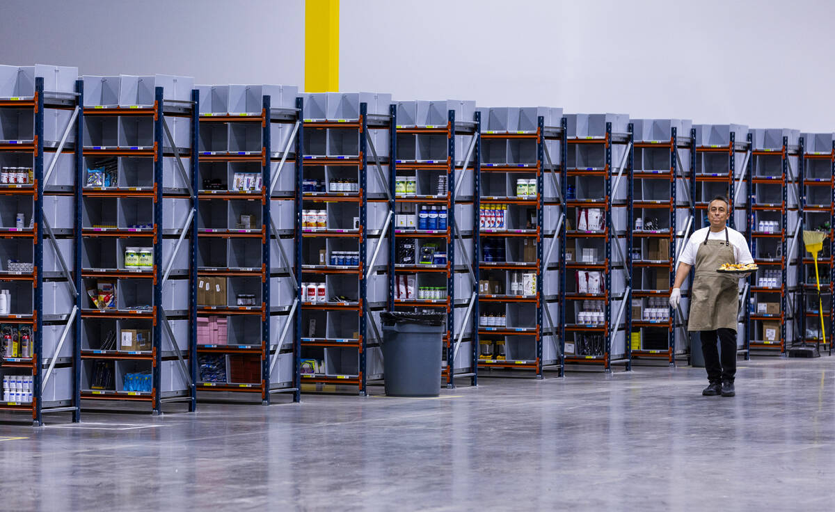 Products are sorted for future processing during a tour of the new distribution facility operat ...