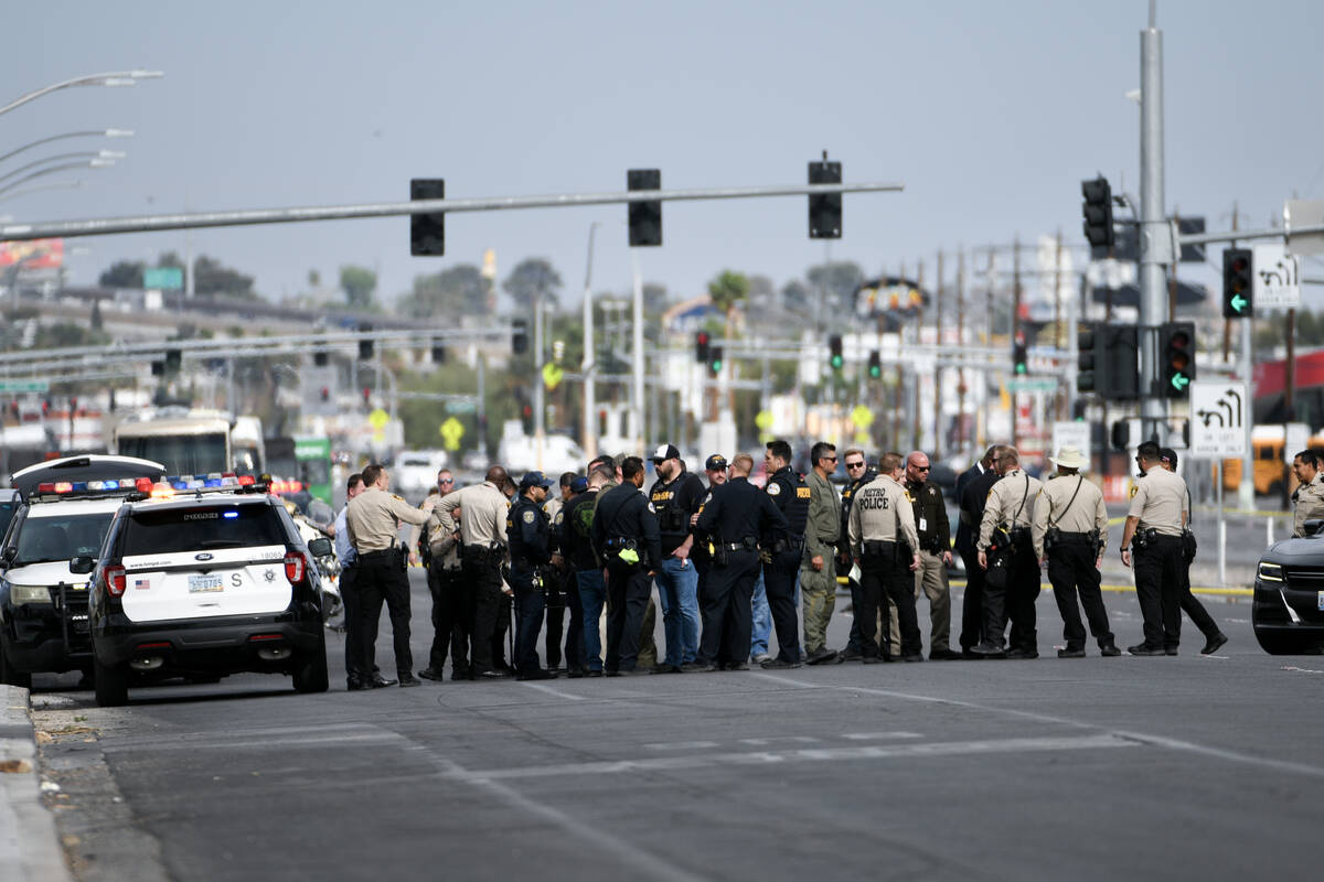Police officers from all over the valley gather on Boulder Highway at Sahara Avenue where a mur ...