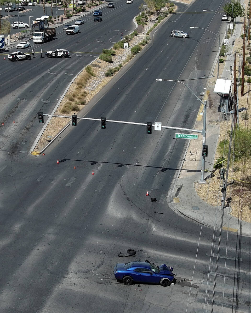 Two wrecked cars sit on Boulder Highway at Tropicana Avenue where a murder suspect crashed into ...
