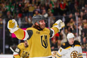Golden Knights left wing Brandon Saad (20) celebrates teammate Golden Knights left wing Pavel D ...