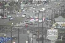 Police investigate a crash and pursuit Thursday, March 27, 2025, on Boulder Highway near Inters ...