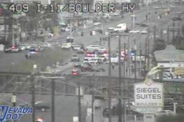 Police investigate a crash and pursuit Thursday, March 27, 2025, on Boulder Highway near Inters ...