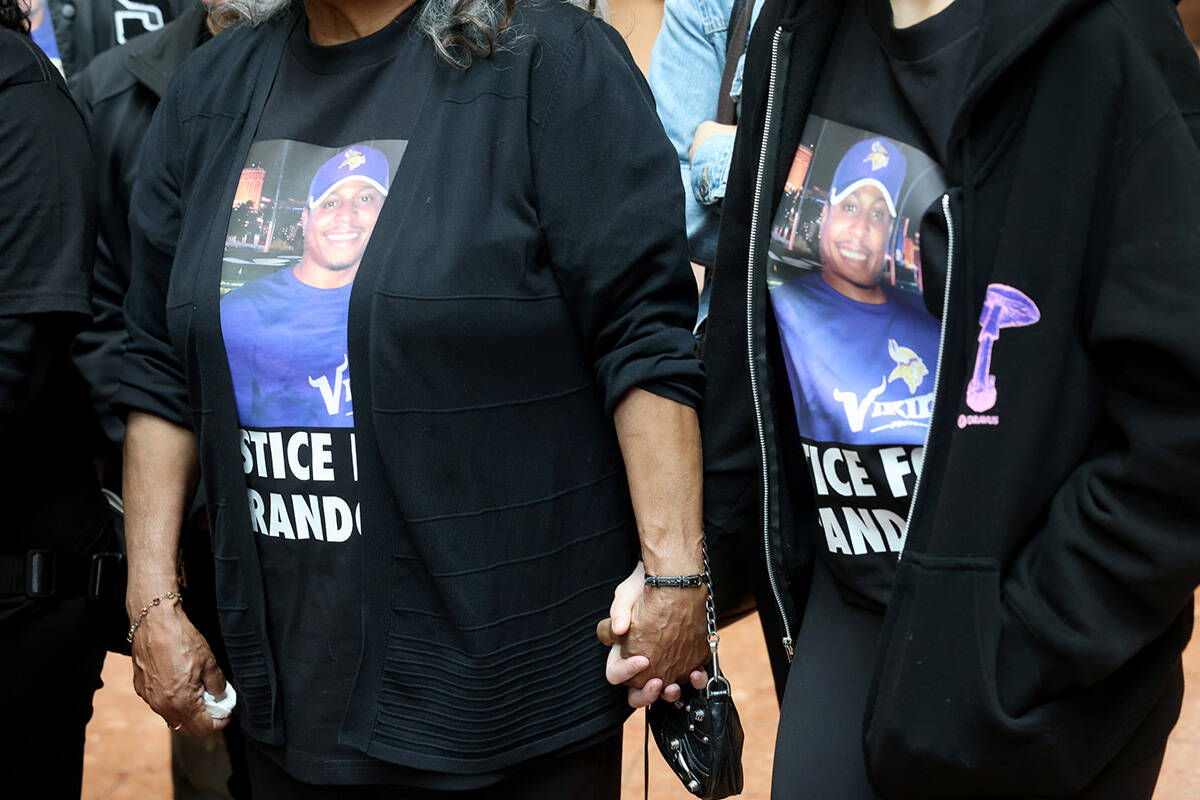 Family members of Brandon Durham, who was shot and killed by police after reporting a home inva ...