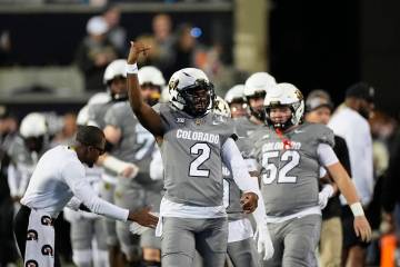 Colorado quarterback Shedeur Sanders (2) warms up before an NCAA college football game Saturday ...