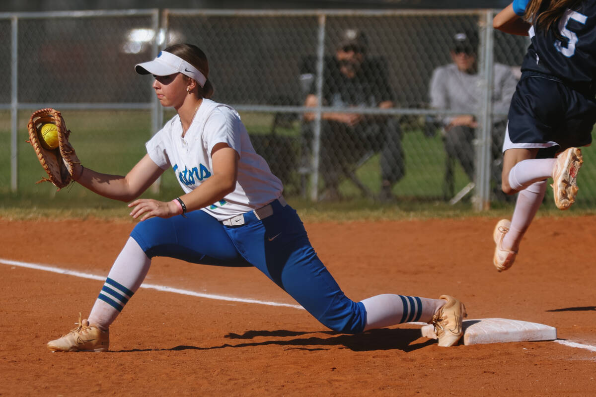 Green Valley first base Madelynne Cotton (14) puts out Centennial runner Valeria Lopez (5) duri ...