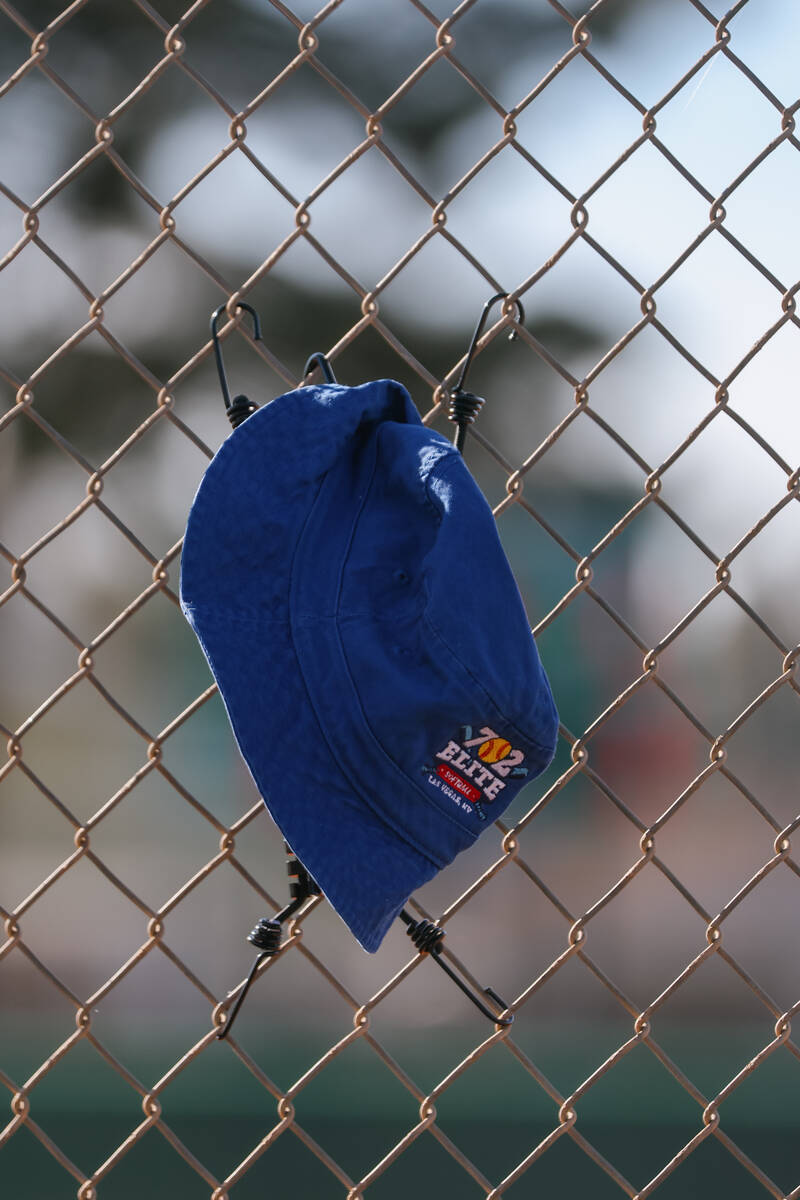 A 702 Elite softball hat protects a pitch camera from the elements during the softball game bet ...