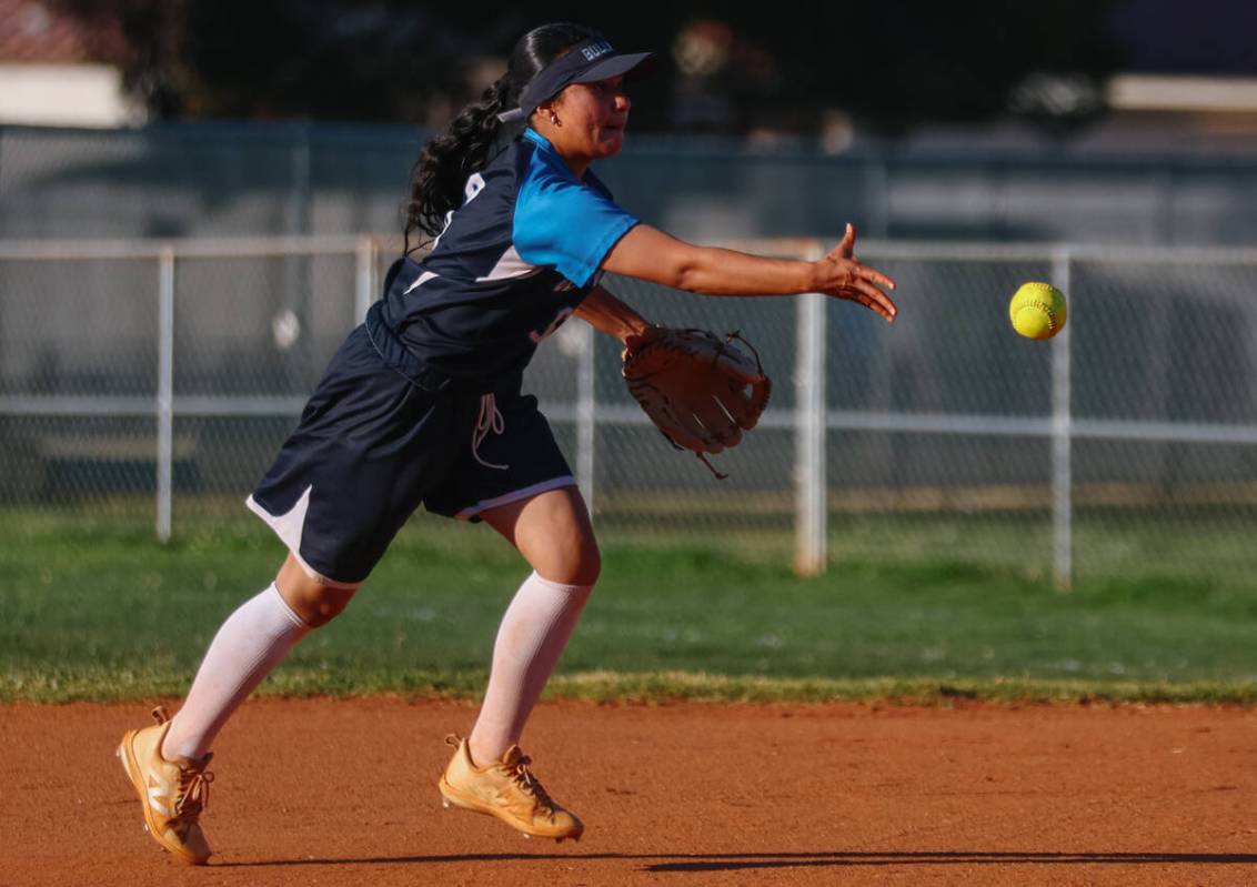 Centennial second base Leeah Ibarra (6) tosses the ball to first during the softball game again ...