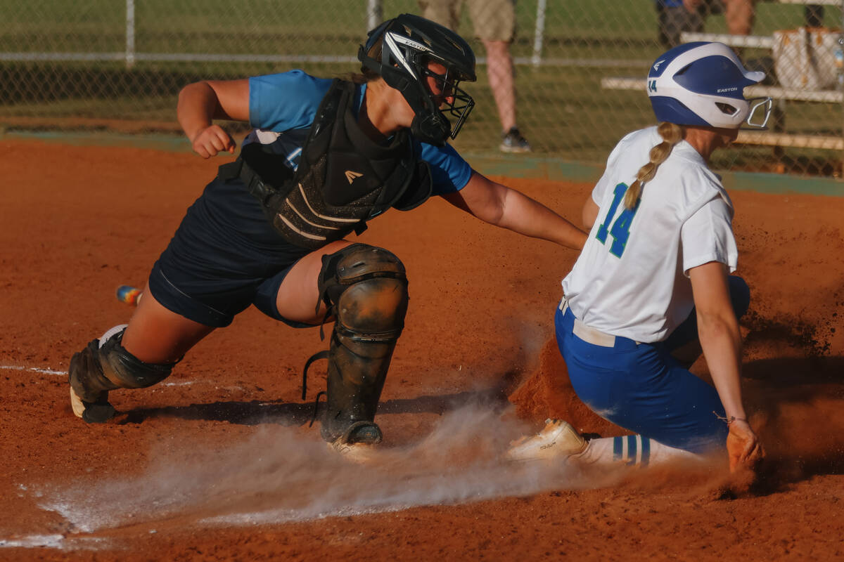 Centennial catcher Campbell Cole (12) tags Green Valley’s Madelynne Cotton (14) at home ...