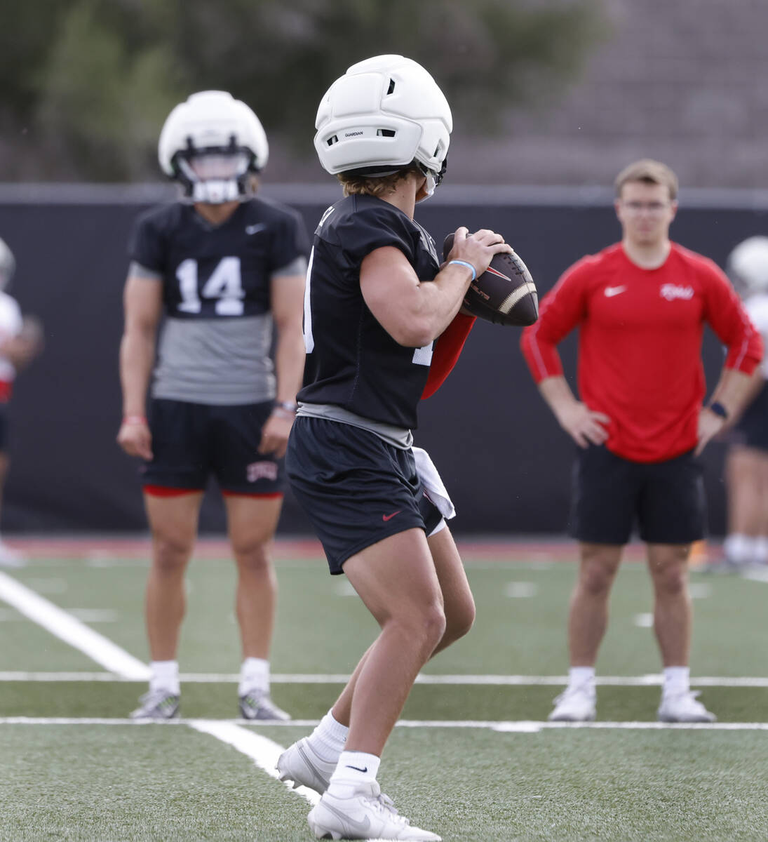 UNLV quarterback Anthony Colandrea (10) prepares to throw the ball as quarterback Gael Ochoa (1 ...
