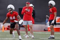 UNLV football head coach Dan Mullen, center, watches team practice, on Thursday, March 27, 2025 ...