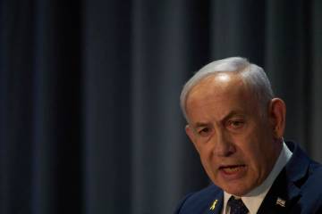 Israel's Prime Minister Benjamin Netanyahu delivers a speech during the International Conferenc ...