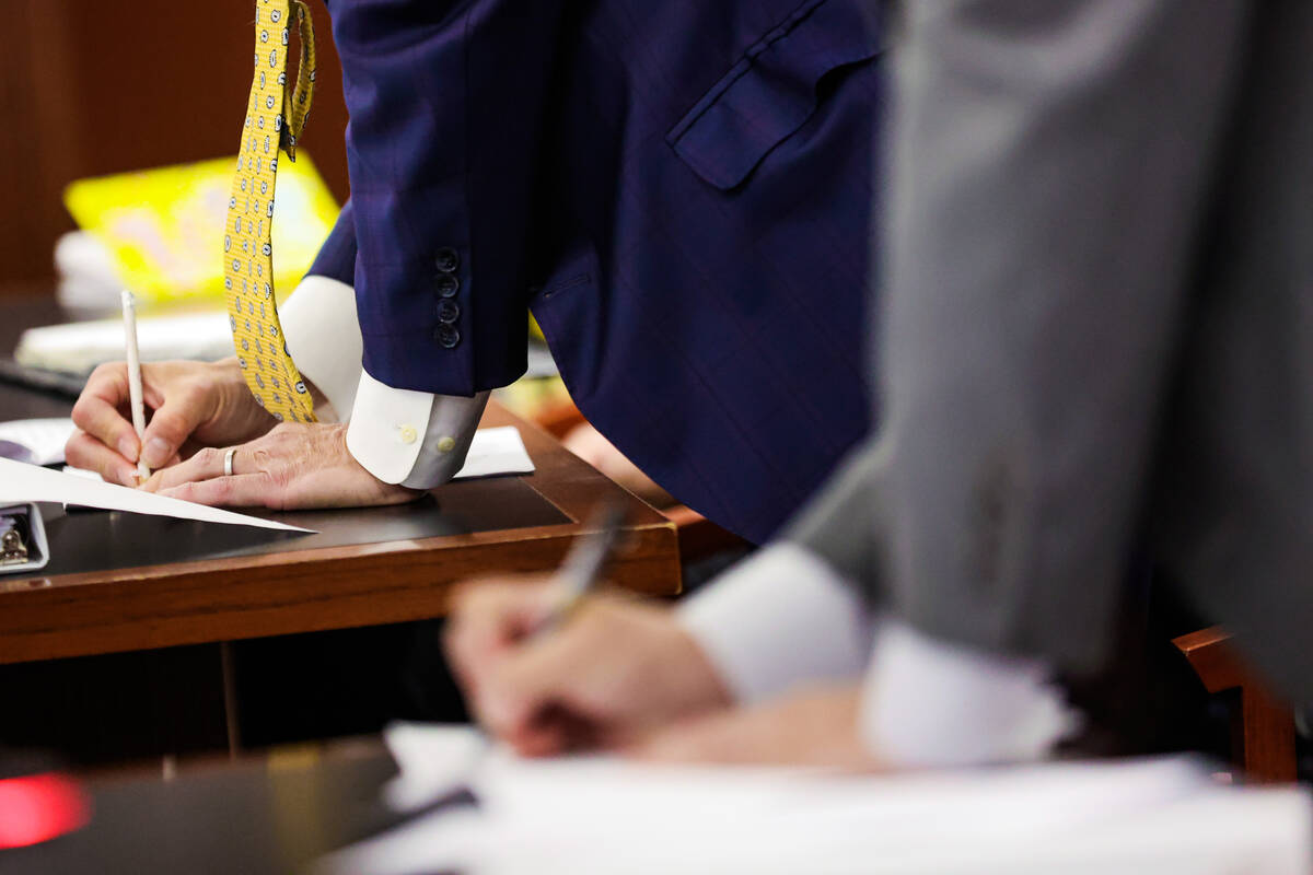 Attorney Jack Juan writes down notes during a court hearing in O.J. Simpson’s estate cas ...