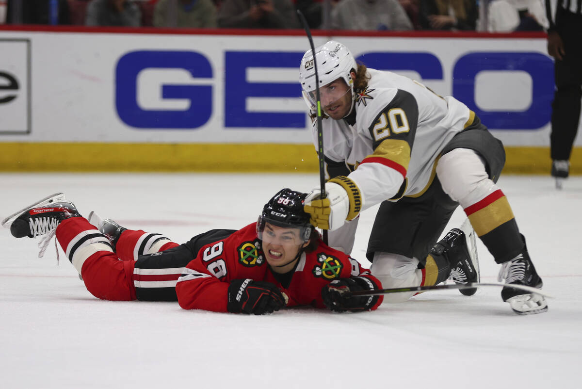 Vegas Golden Knights left wing Brandon Saad (20) and Chicago Blackhawks center Connor Bedard (9 ...