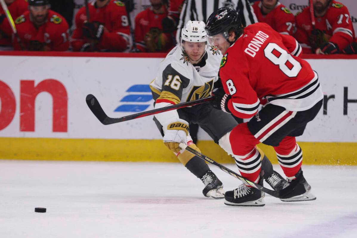 Chicago Blackhawks center Ryan Donato (8) and Vegas Golden Knights left wing Pavel Dorofeyev (1 ...