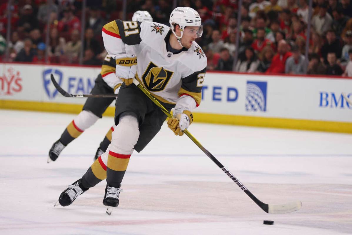 Vegas Golden Knights center Brett Howden (21) brings the puck up ice during the first period of ...