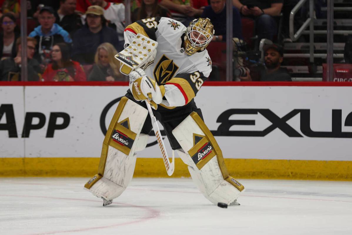 Vegas Golden Knights goaltender Adin Hill passes the puck during the second period of an NHL ho ...