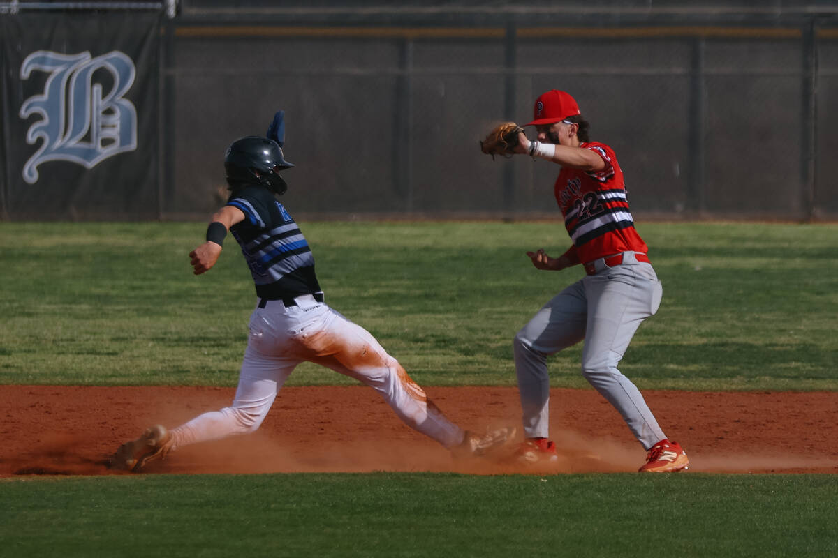 Basic Academy’s Andruw Giles (29) makes a dash back to second base after attempting a st ...