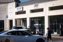 Las Vegas police investigate the scene and get information from people who said they were victi ...