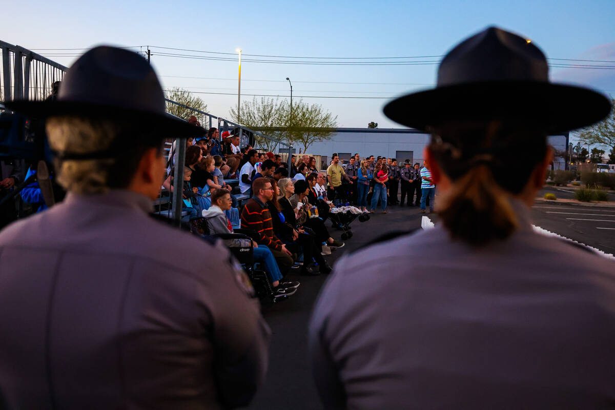 Mourners gather during a vigil hosted by the Nevada Highway Patrol to honor traffic accident vi ...