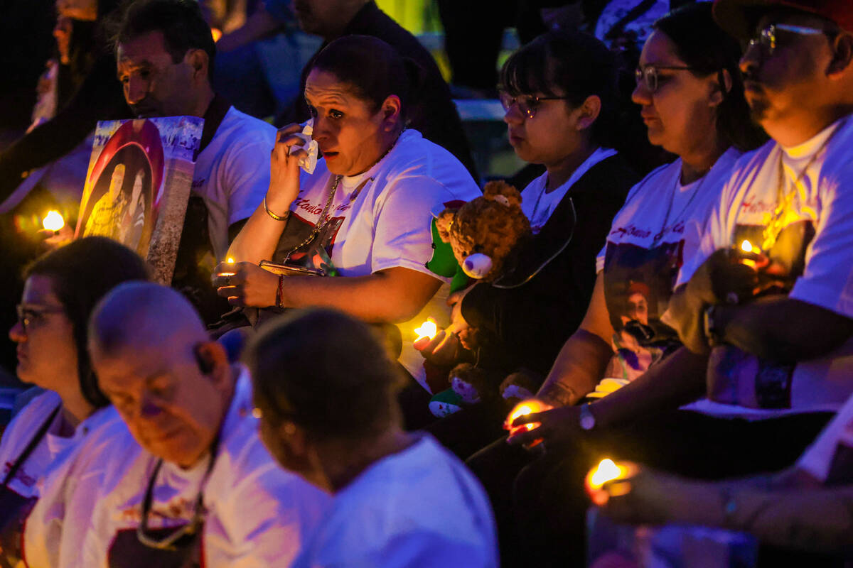 A mourner cries during a vigil hosted by the Nevada Highway Patrol to honor traffic accident vi ...
