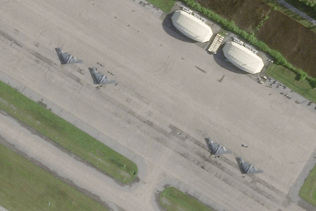 This satellite photo from Planet Labs PBC shows four B-2 stealth bombers parked at Camp Thunder ...