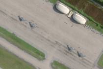 This satellite photo from Planet Labs PBC shows four B-2 stealth bombers parked at Camp Thunder ...