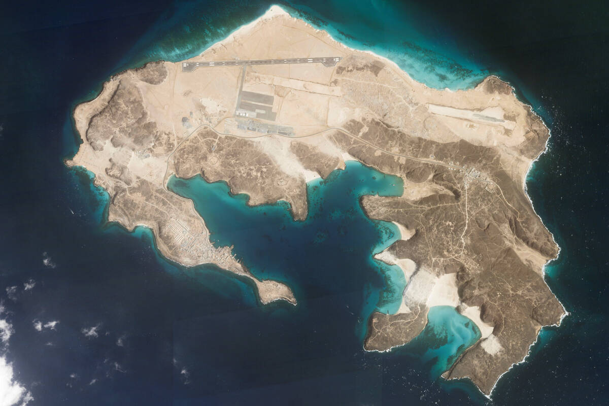 This satellite photo from Planet Labs PBC shows an airstrip on Mayun Island, also known as Peri ...