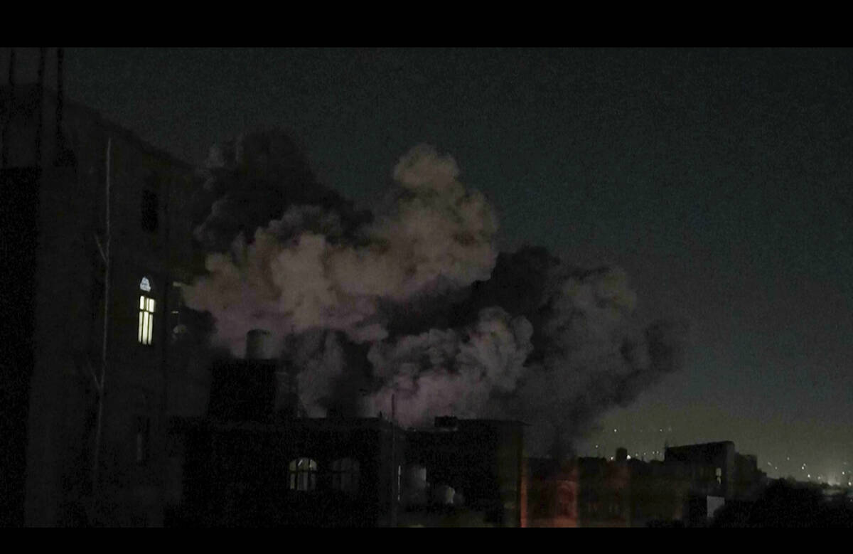 In this image made from video, smoke rises after a blast in Sanaa, Yemen, Friday, March 28, 202 ...