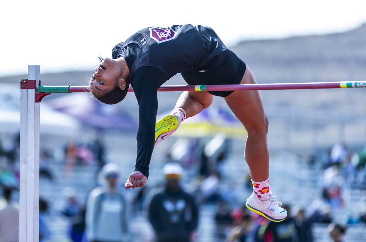 Faith Lutheran's Aliyah Maese clears the bar on the way to winning the varsity girls high jump ...