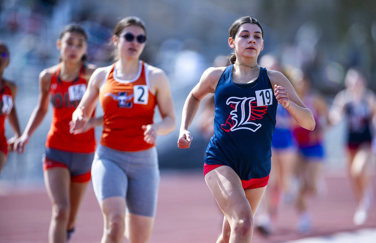 A Liberty runner leads the first heat of the varsity girls 1600 meters race during the 2025 Las ...