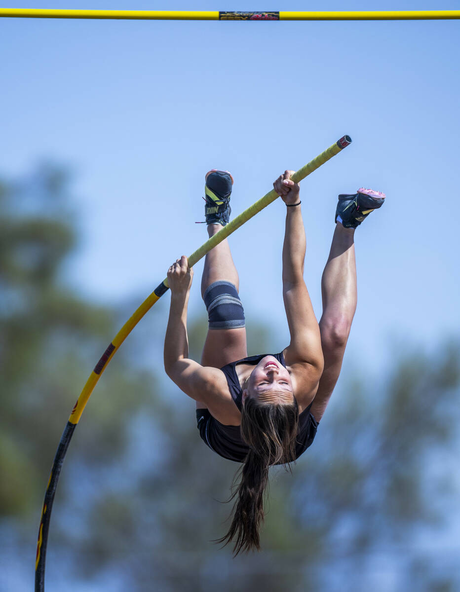 Faith Lutheran's Madelynn Murray looks upward on her way to the pole in the varsity girls pole ...