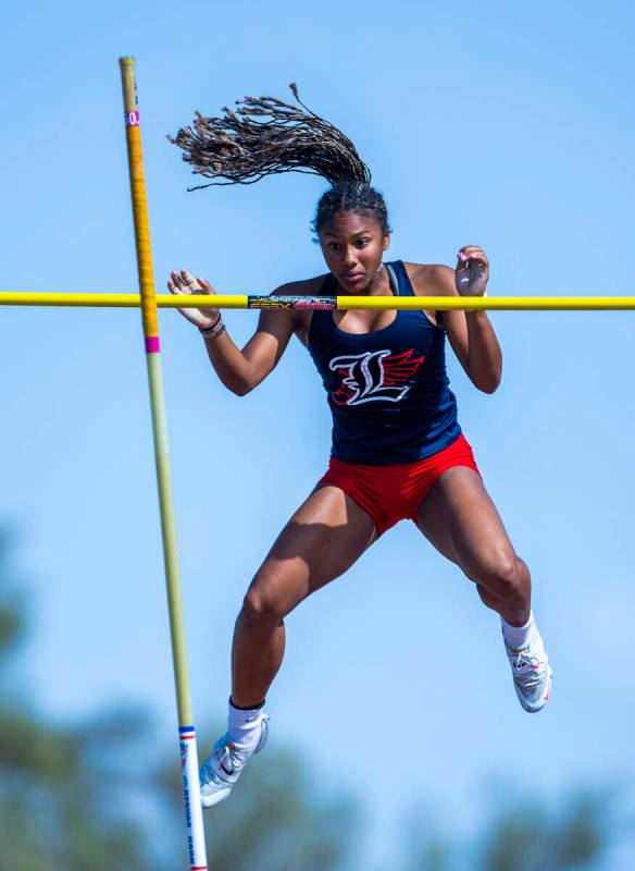 Liberty's Isabella Clark eyes the pole after clearing 11-2 in the varsity girls pole vault duri ...