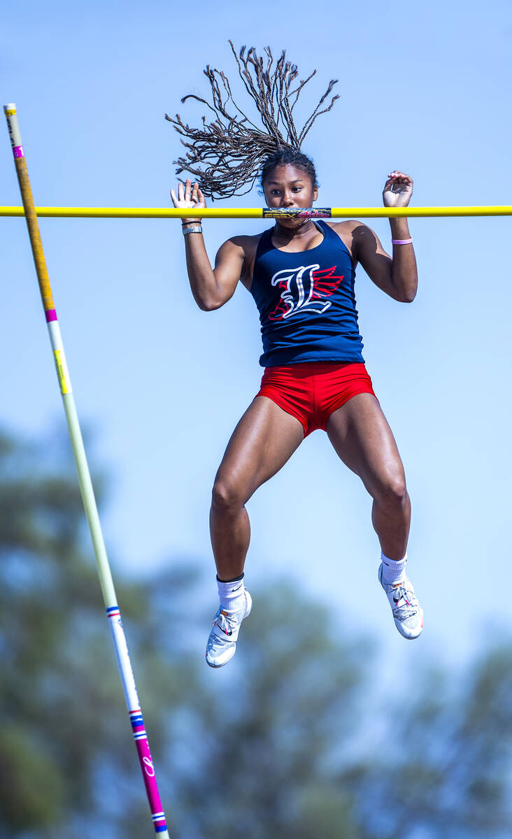Liberty's Isabella Clark eyes the pole after clearing 11-8 for the win in the varsity girls pol ...