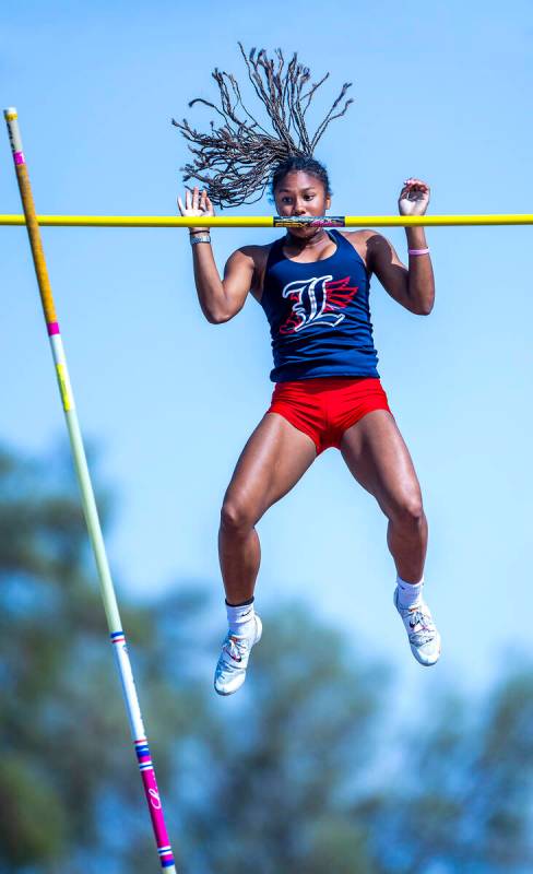 Liberty's Isabella Clark eyes the pole after clearing 11-8 for the win in the varsity girls pol ...