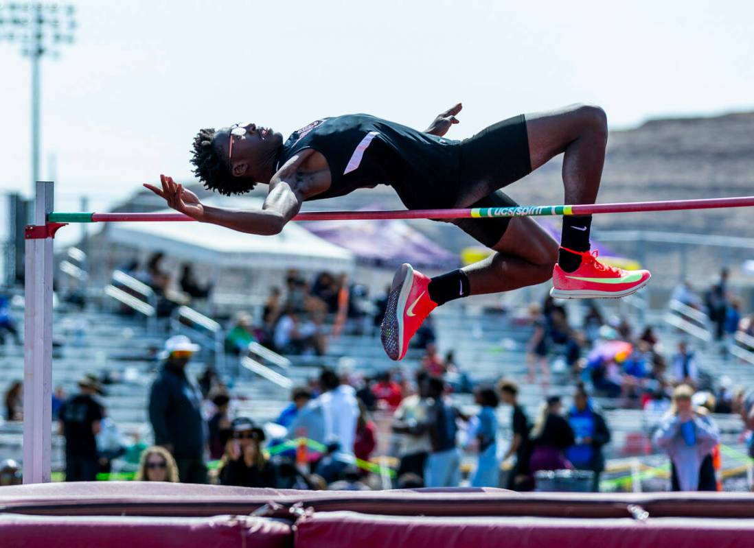 A Desert Oasis athlete attempts to clear the bar in the varsity boys high jump during the 2025 ...